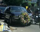 jakarta-street-scenes-funeral-decorated-car-april-2008.JPG