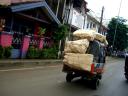 loaded-bajaj-rear-view-with-pink-house-may-2008.JPG