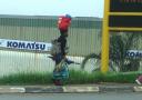 african-people-pictures-lady-carrying-orange-parcel-on-head-mbabane-mar-2009.JPG