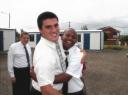 18-dec-2009-president-wengert-hugging-elder-mbhiti-with-pres-mann-in-back.JPG